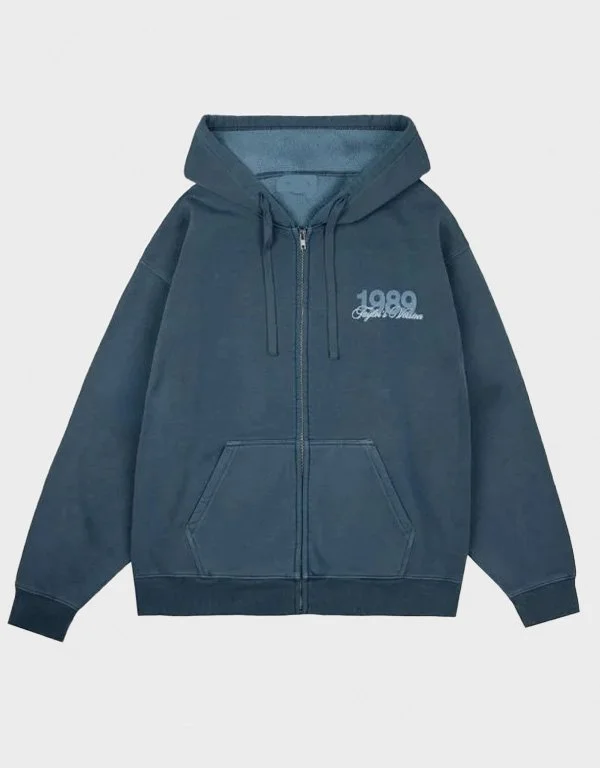 Front view of 1989 Taylor’s Version Is It Over Now blue zip-up hoodie with embroidered chest logo and full zip design
